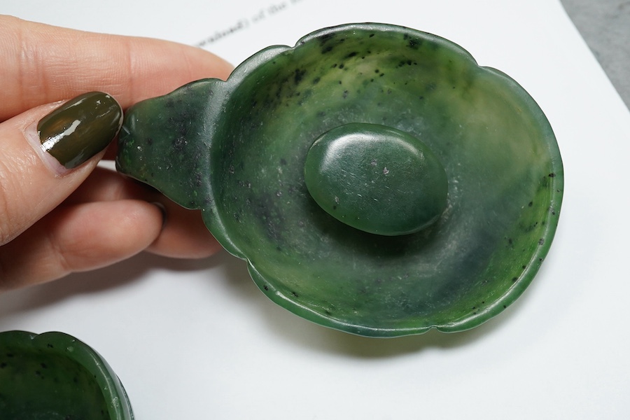 A Chinese spinach green jade two-piece belt buckle, 18th/19th century